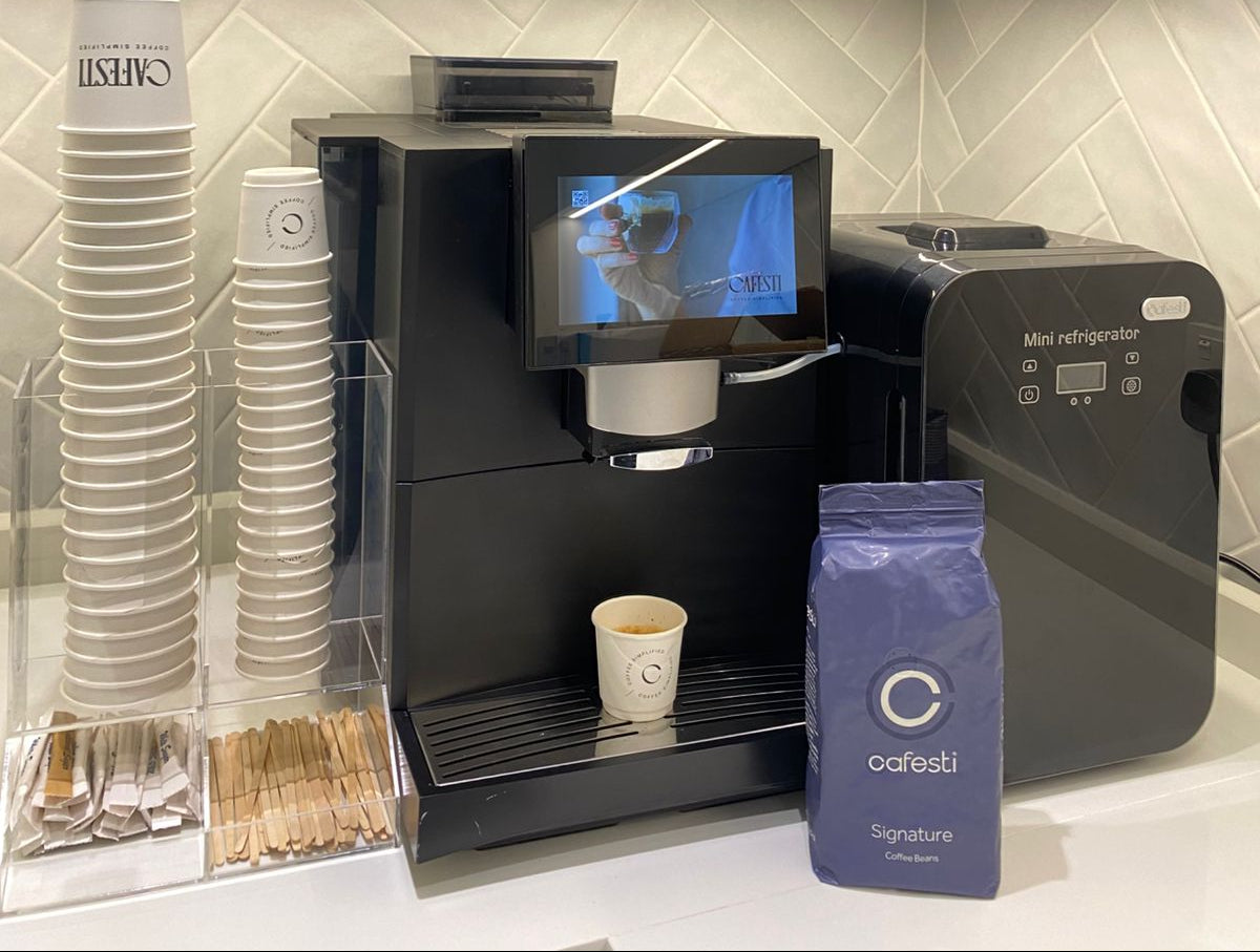 Cafesti bean-to-cup machine with a bag of Cafesti Signature beans