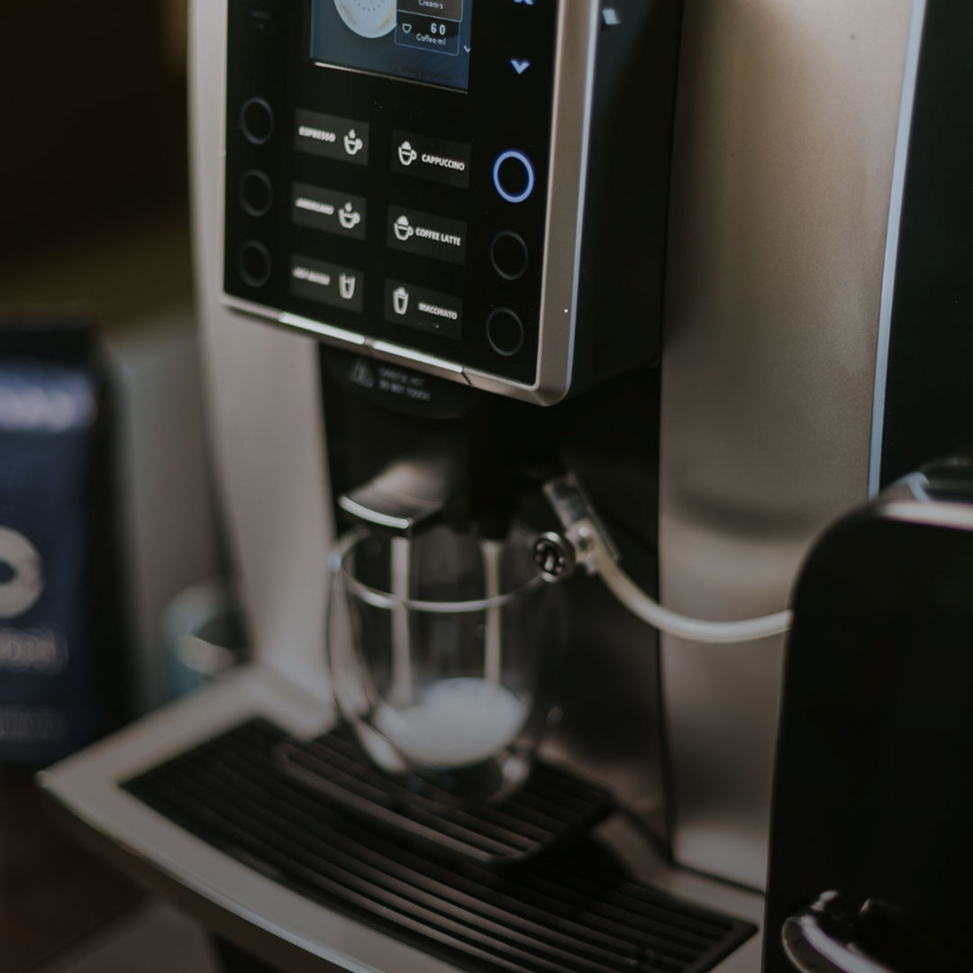 Automatic Coffee machines with an integrated milk dispenser and a creamy cappuccino with foam